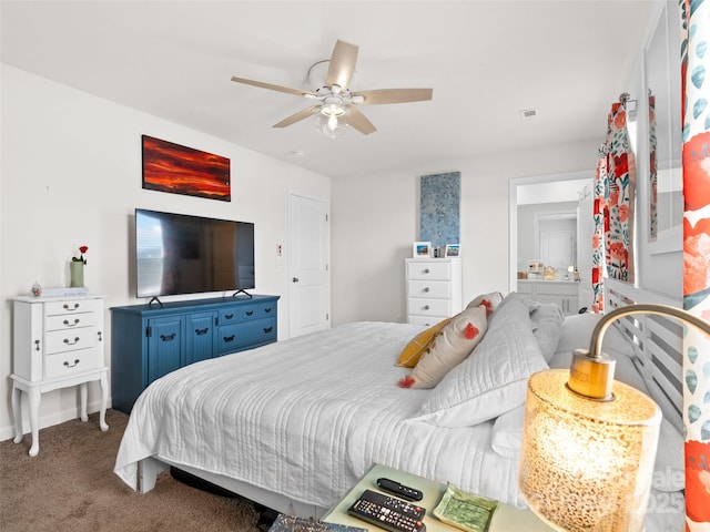 bedroom with ceiling fan, connected bathroom, and carpet