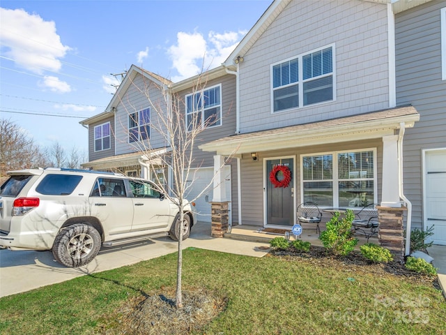 view of front of property featuring a front lawn and covered porch