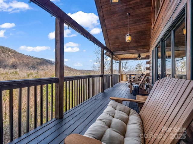 wooden deck with a mountain view