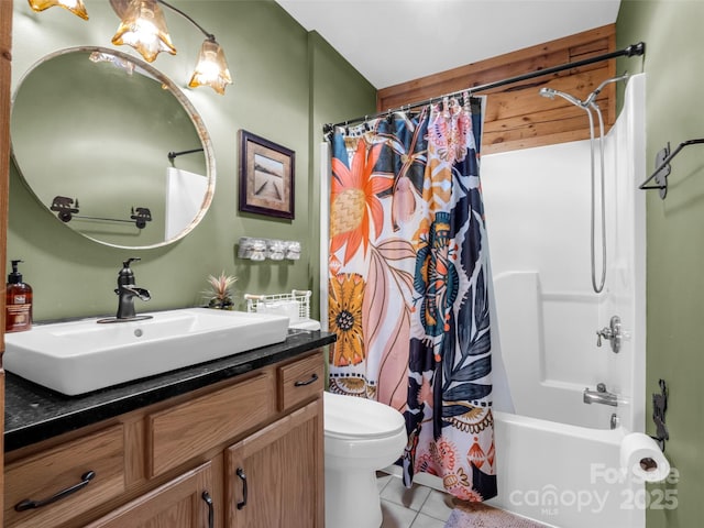 full bath with tile patterned floors, toilet, vanity, and shower / bath combo with shower curtain