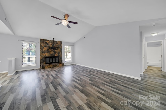 unfurnished living room with ceiling fan, a fireplace, dark hardwood / wood-style floors, and lofted ceiling