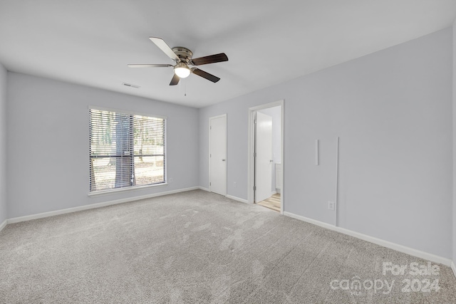 carpeted empty room with ceiling fan