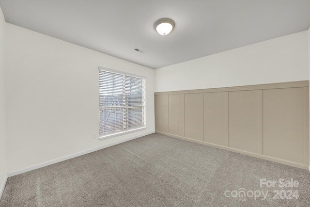 empty room with light colored carpet