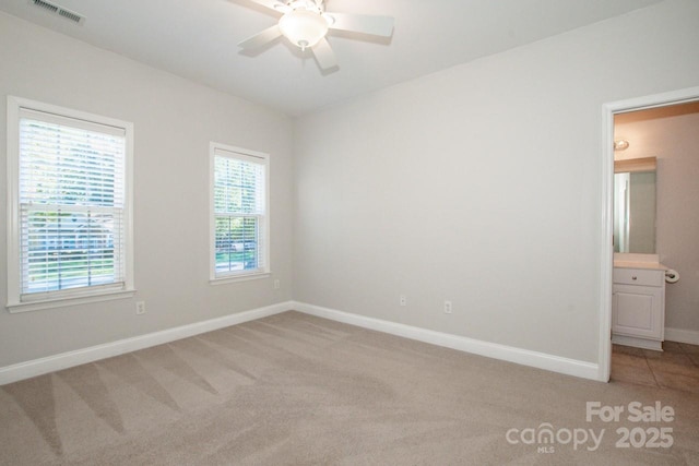 carpeted empty room with ceiling fan