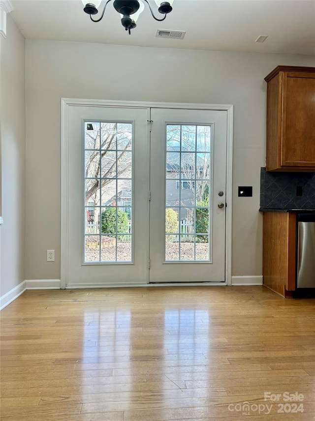 doorway to outside with light hardwood / wood-style flooring