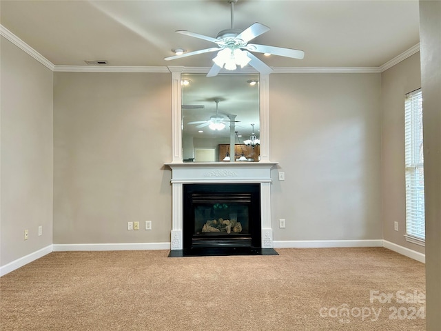 unfurnished living room featuring plenty of natural light, carpet floors, and crown molding