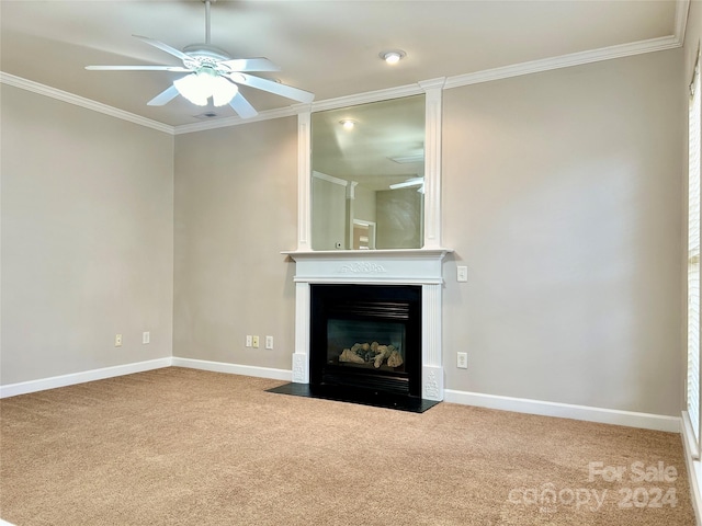 unfurnished living room with carpet, ceiling fan, and crown molding