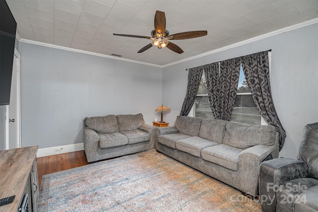 living room with ceiling fan, wood-type flooring, and ornamental molding