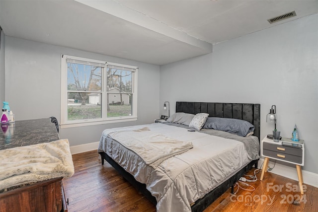 bedroom featuring dark wood-type flooring