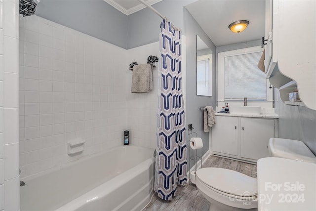 full bathroom featuring vanity, shower / bath combination with curtain, crown molding, toilet, and wood-type flooring