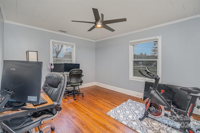 home office with hardwood / wood-style floors, plenty of natural light, crown molding, and ceiling fan