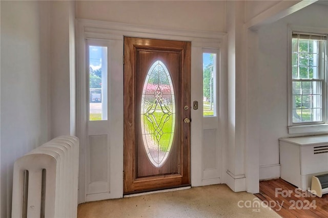 entryway with radiator and light wood-type flooring