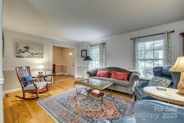 living room featuring crown molding and wood-type flooring