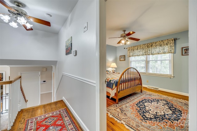 bedroom featuring wood-type flooring and ceiling fan