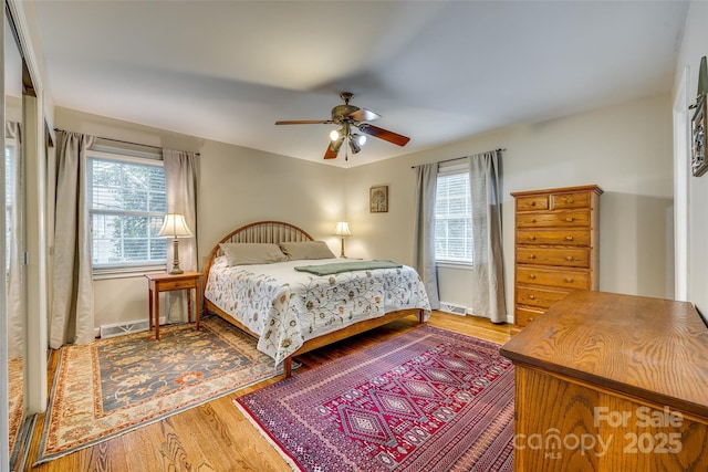 bedroom featuring ceiling fan and hardwood / wood-style floors