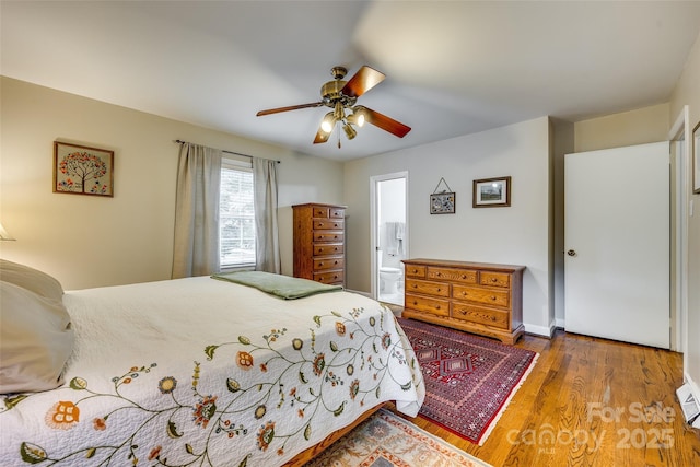 bedroom with wood-type flooring, ensuite bath, and ceiling fan