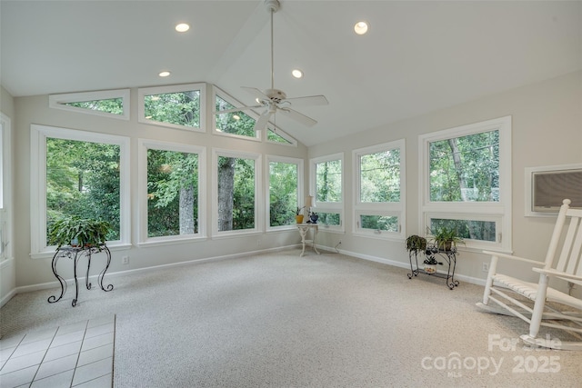 sunroom with an AC wall unit, ceiling fan, and vaulted ceiling