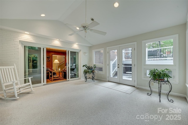 unfurnished sunroom featuring french doors, vaulted ceiling, and ceiling fan