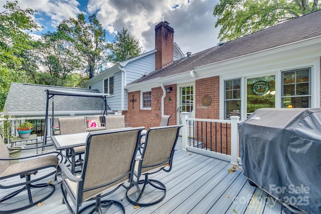 wooden deck featuring grilling area