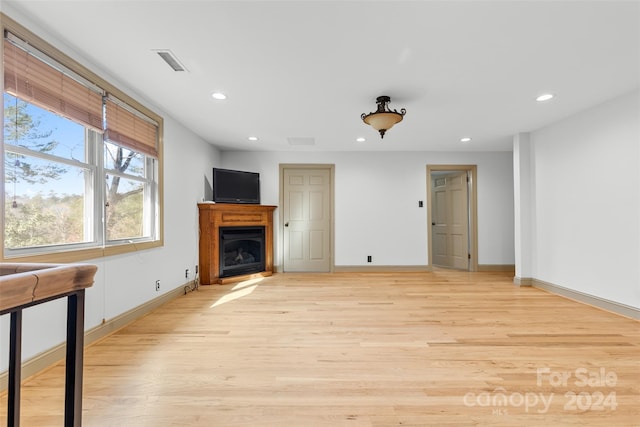 unfurnished living room with light hardwood / wood-style floors