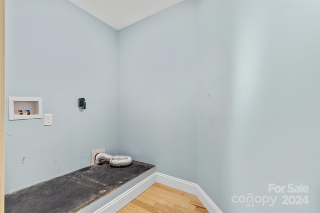 laundry area with washer hookup and hardwood / wood-style flooring