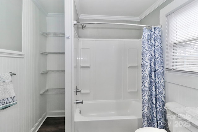 bathroom with crown molding, toilet, shower / bath combo with shower curtain, and hardwood / wood-style flooring