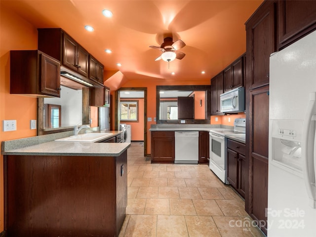 kitchen with dark brown cabinetry, ceiling fan, sink, kitchen peninsula, and white appliances