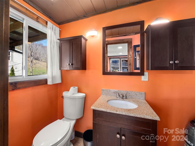 bathroom featuring vanity, toilet, wooden ceiling, and crown molding