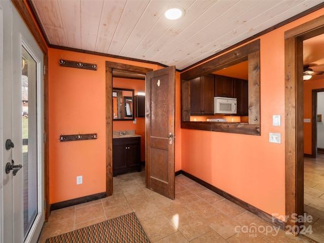 corridor with wood ceiling and crown molding