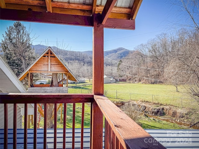 wooden terrace featuring a mountain view