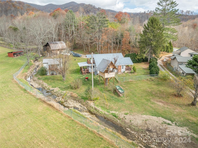 birds eye view of property featuring a mountain view