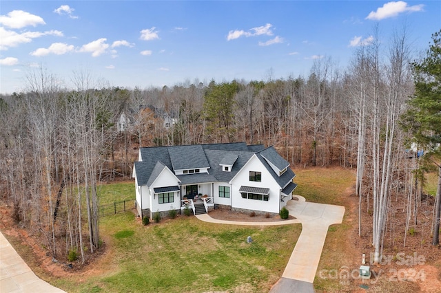 view of front of house with a porch and a front yard