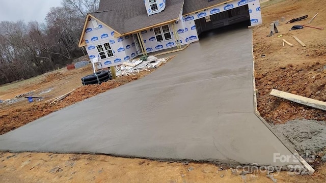 exterior space featuring concrete driveway