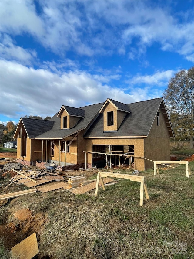 rear view of house with stucco siding