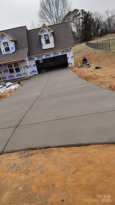 exterior space featuring concrete driveway