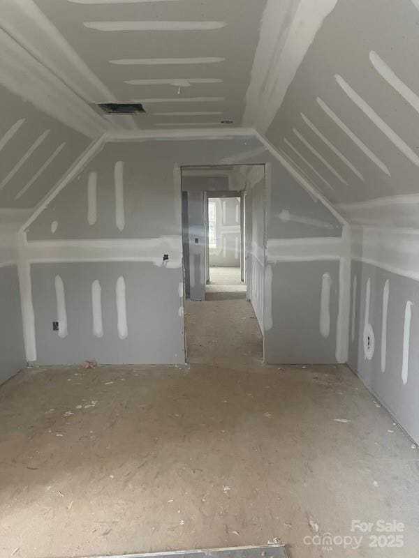 bonus room featuring visible vents and vaulted ceiling