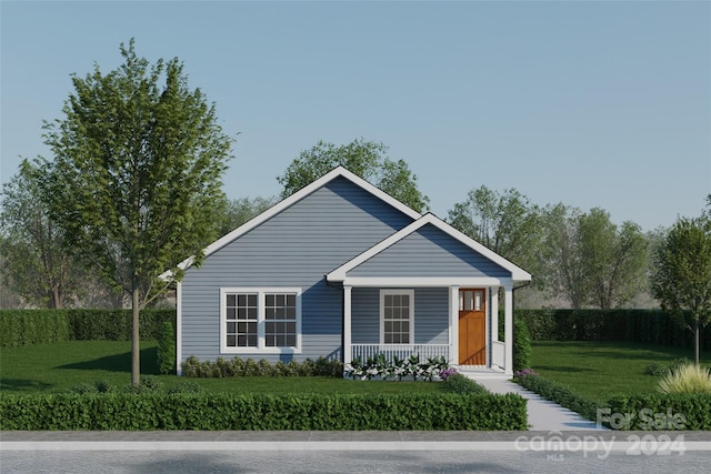 view of front of property featuring a front lawn and a porch