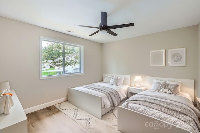 bedroom featuring ceiling fan and light hardwood / wood-style flooring