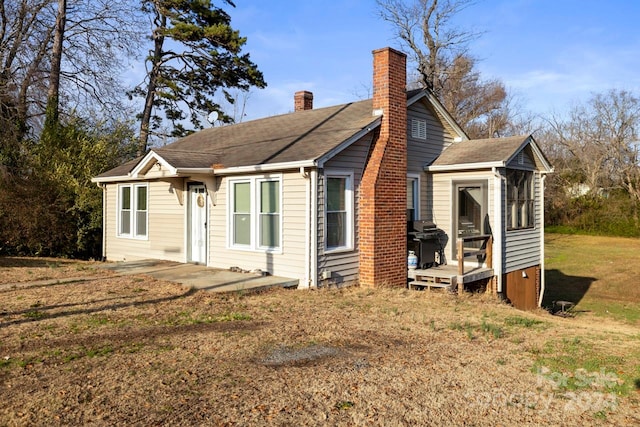 view of side of property with a yard