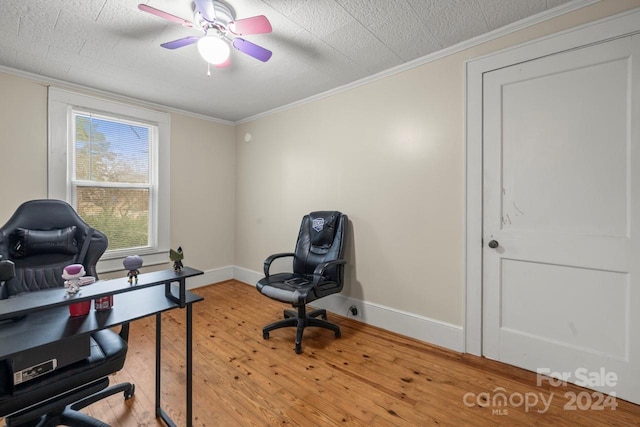 office featuring ceiling fan, wood-type flooring, and crown molding