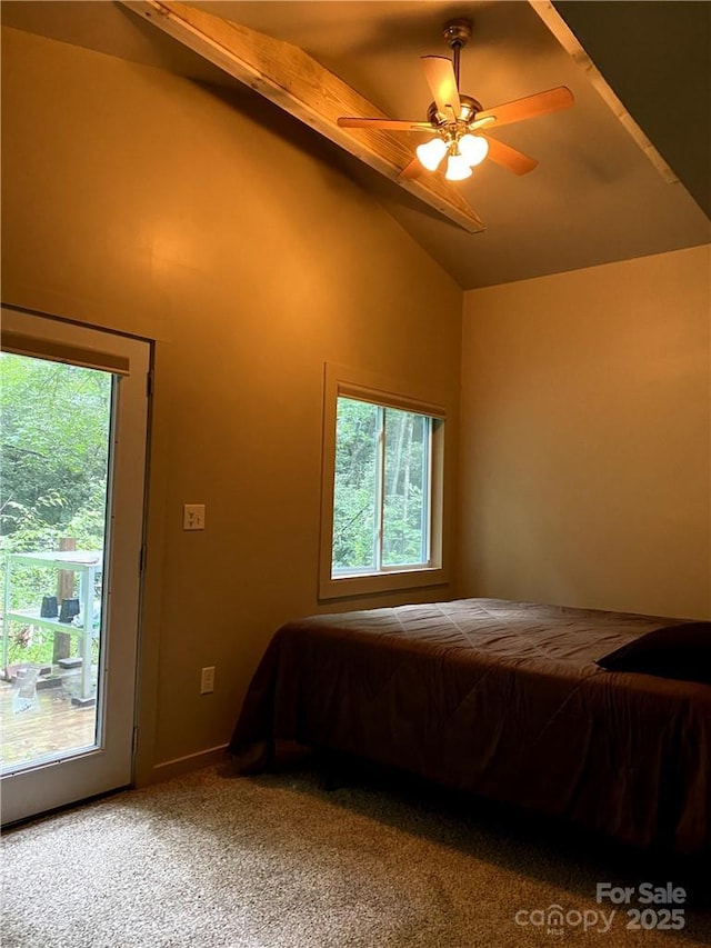 bedroom featuring carpet flooring, multiple windows, ceiling fan, and beamed ceiling