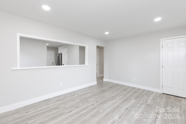 spare room with light wood-type flooring