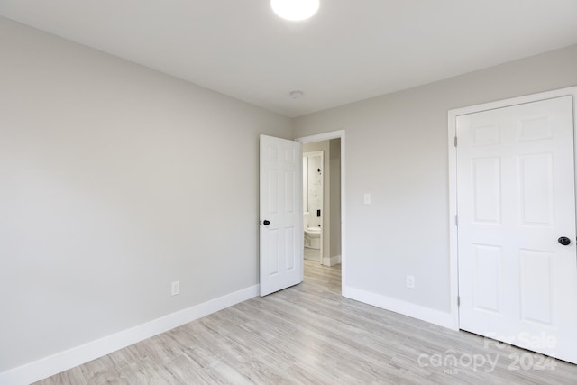 unfurnished bedroom with light wood-type flooring