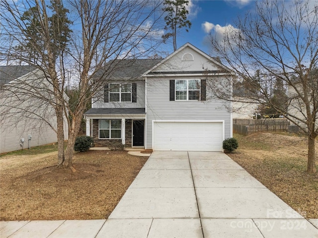 front of property with a garage