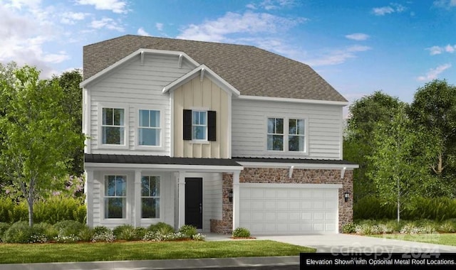 view of front of home with a front yard and a garage