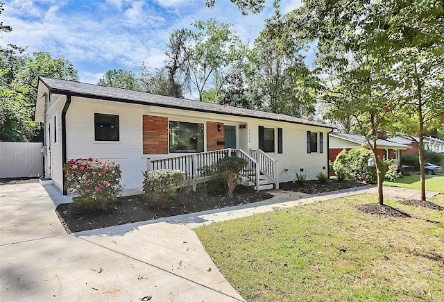 ranch-style house with a front lawn