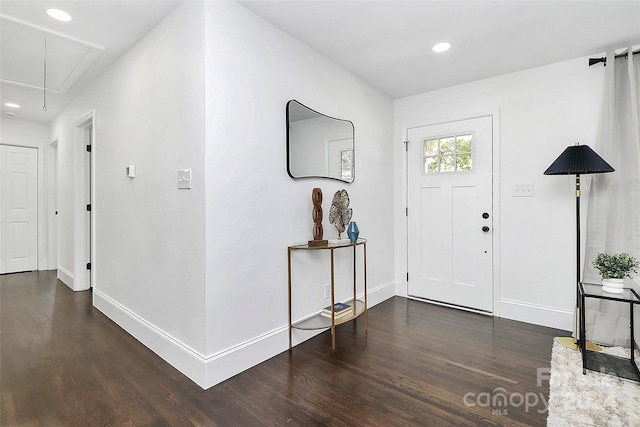 foyer with dark hardwood / wood-style floors