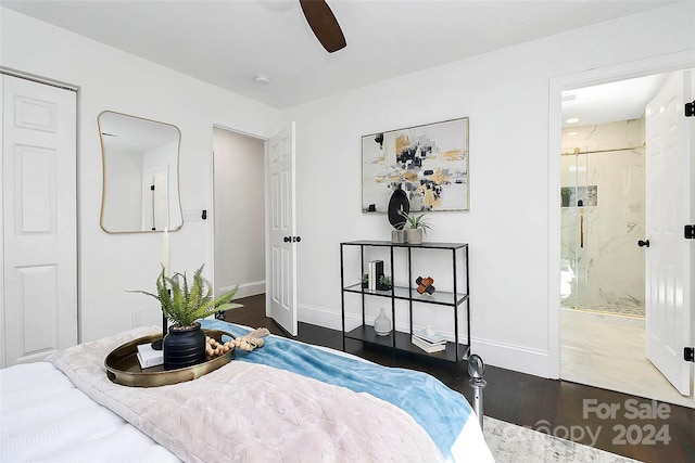 bedroom featuring ceiling fan, ensuite bathroom, and dark wood-type flooring