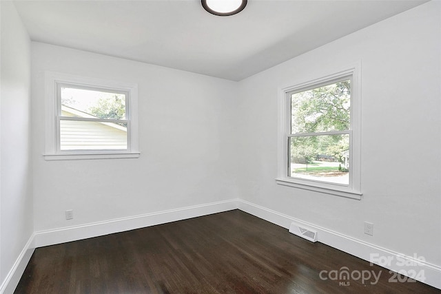 empty room with wood-type flooring