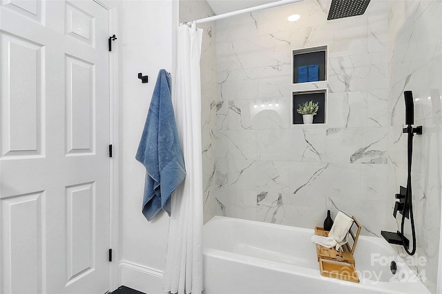 bathroom featuring shower / bath combo with shower curtain